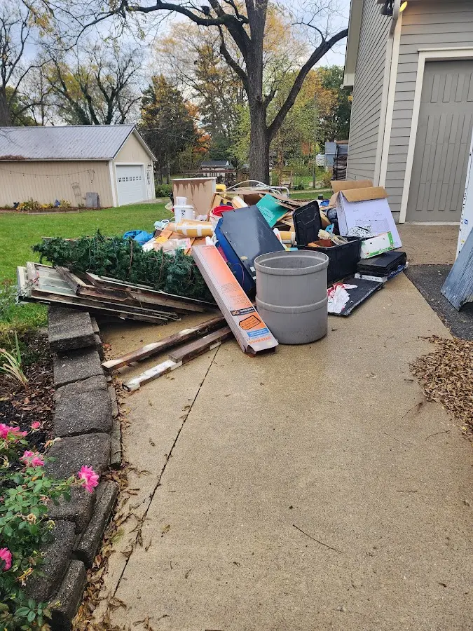 Dumpster being loaded with debris for 30 Yard Dumpster Rental in Citrus Springs